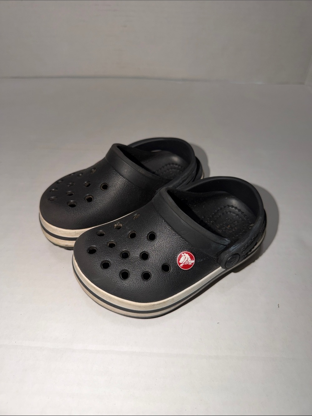 CROCS Kids Black Clog with White Stripe and Red Logo